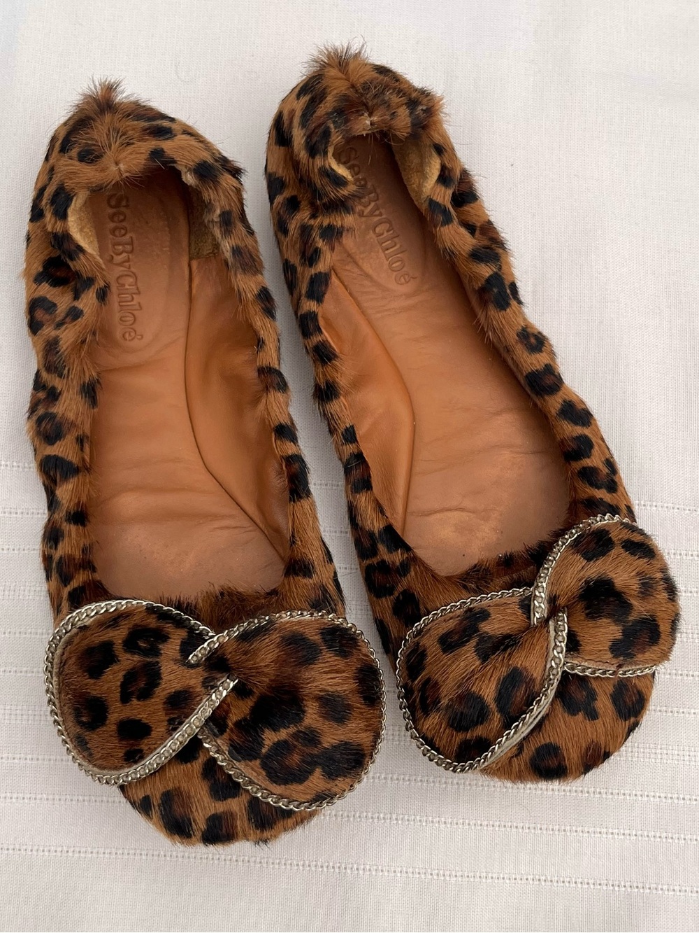 See By Chloe Leopard Print Calf Hair Bow Flats
